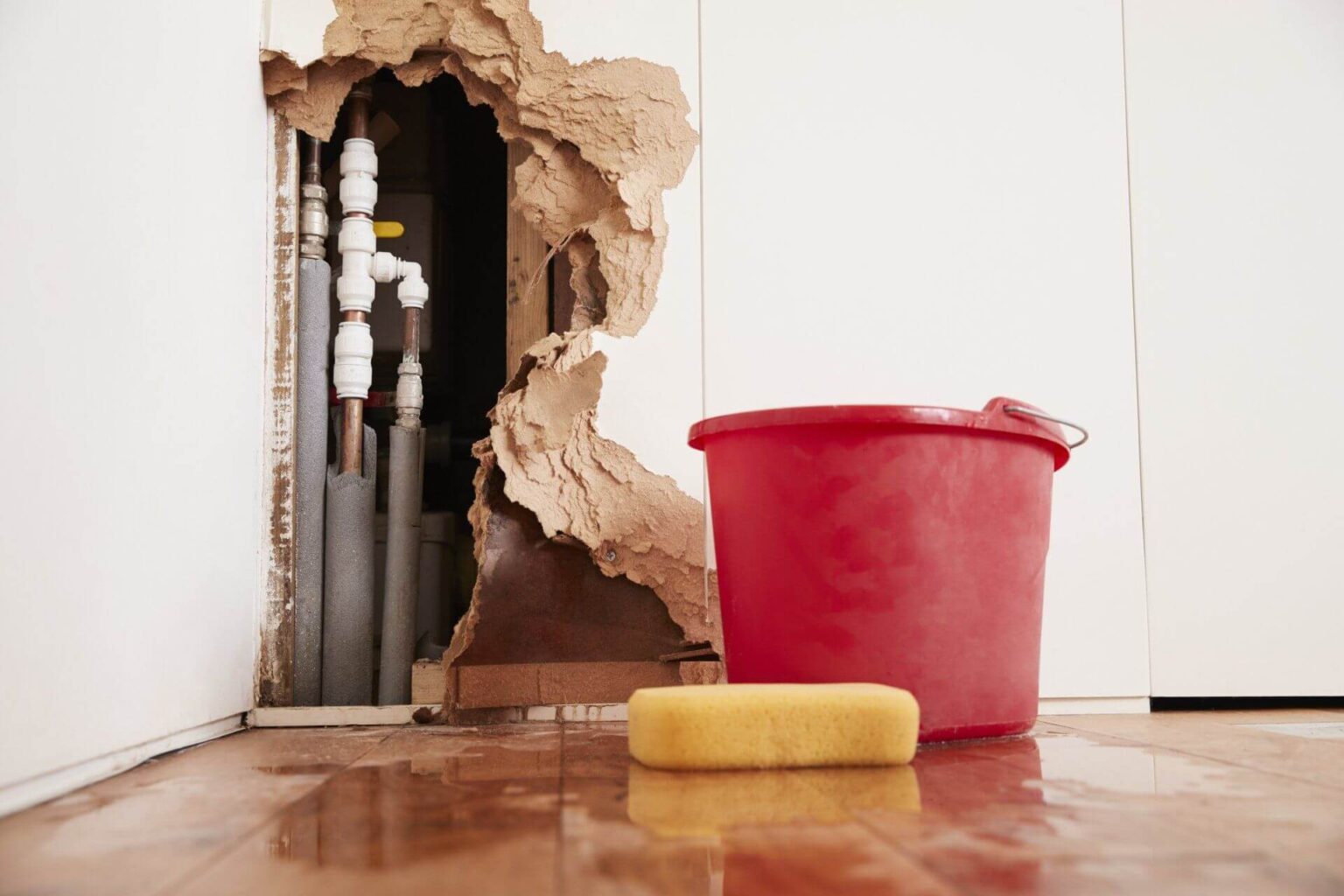 damaged-wall-exposed-burst-water-pipes-sponge-and-PUZLTS3-2880w-1536x1024.jpg
